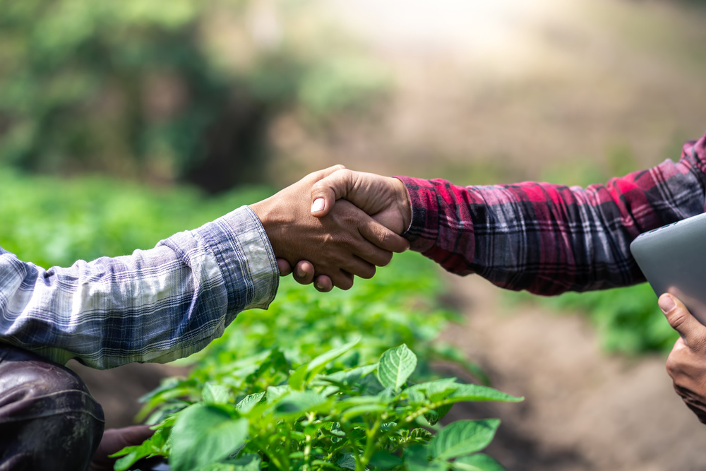 Closeup Hands of Two Farmer Shaking Hands